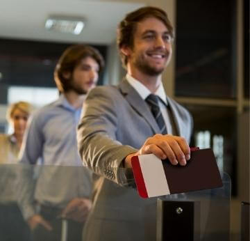 A man in a Grey Suit Showing the passport